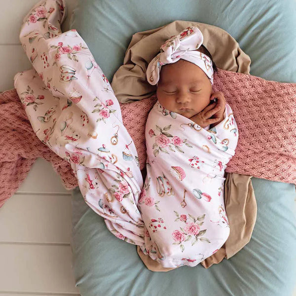 Delivering magic to your little one ❤️🐰❤️ because IMAGINATION is more powerful than knowledge 💭💭💭Snuggle Hunny Organic Jersey Wrap & Topknot set - Alice's Tea Party