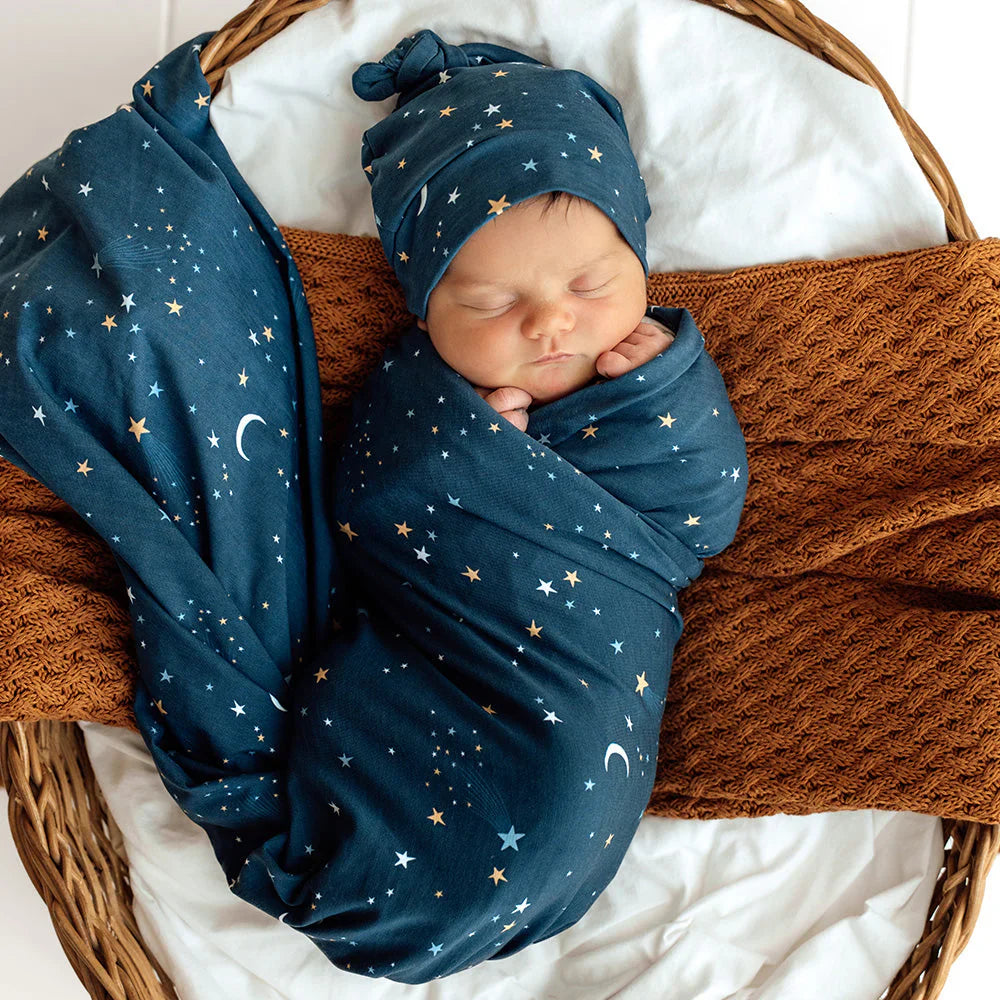 New from Snuggle Hunny - Starry Night ✨️  This Organic Jersey Cotton Wrap and Beanie set is perfect for swaddling baby, as a comforting blanket for a cot or bassinet, for using over a pram when out and about or and as a feeding cover. 