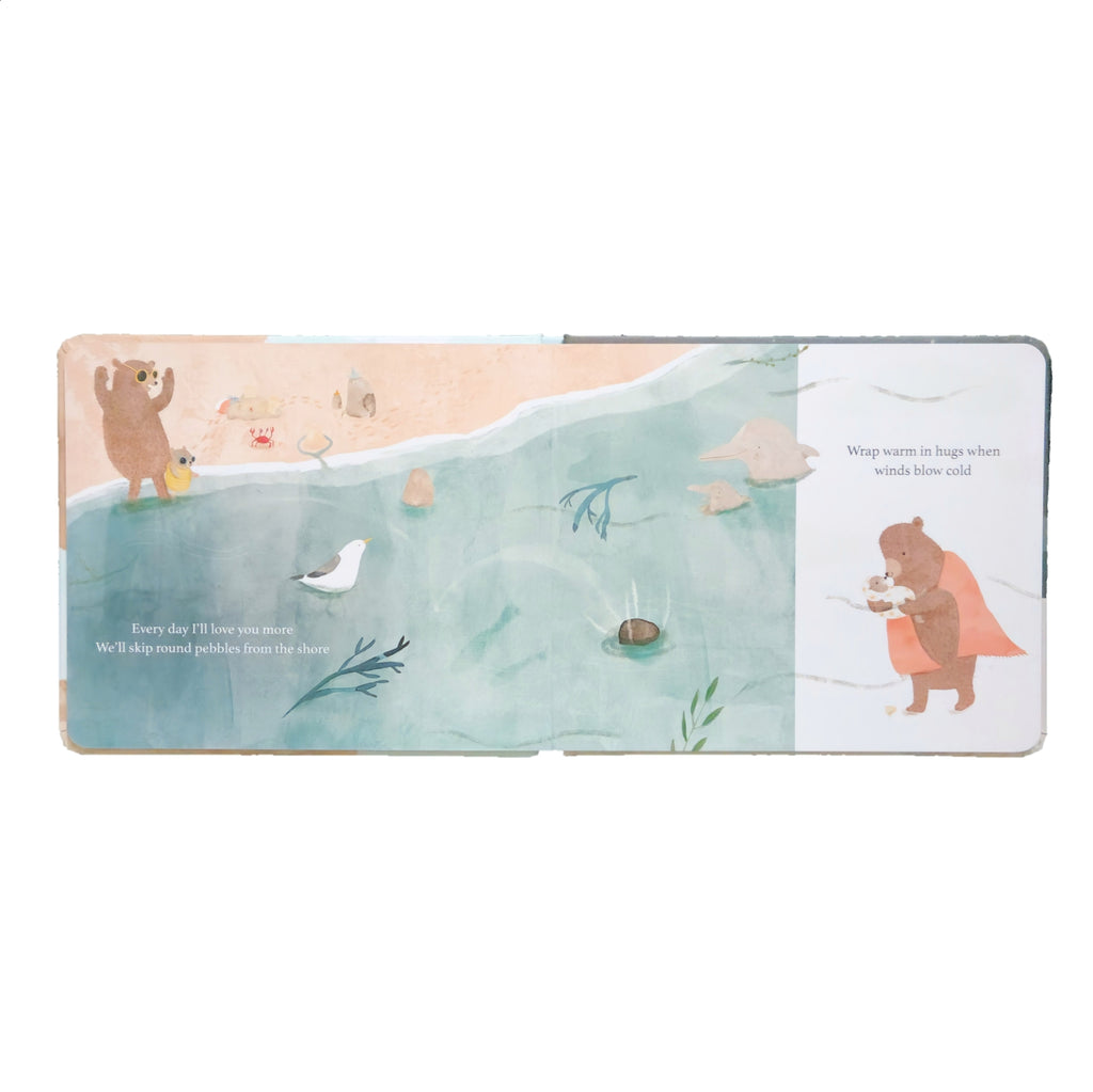 Illustrated children's book by JESS RACKLYEFT, Welcome Baby to this world, open to a page with a bear and bird on a snowy landscape.