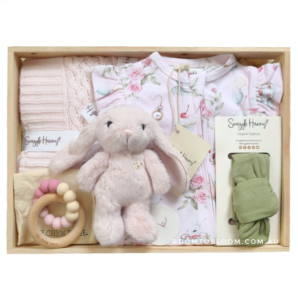 ROOM TO BLOOM Alice Baby Gift Hamper set with pink plush toy, teething ring, and other items in a wooden box.