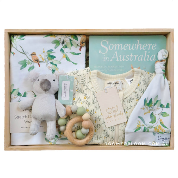 ROOM TO BLOOM Australiana Baby Gift Hamper Baby gift set with soft toy, clothing, and more in a wooden box.