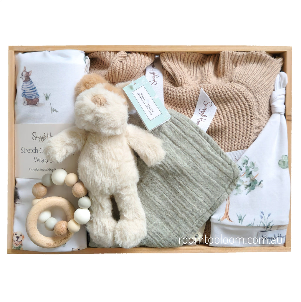 ROOM TO BLOOM Best Friends Baby Gift Hamper set with plush toy, knitted blanket, and other items in a wooden box.