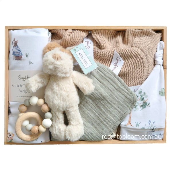 ROOM TO BLOOM Best Friends Baby Gift Hamper set with plush toy, knitted blanket, and other items in a wooden box.