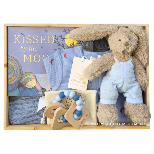 ROOM TO BLOOM Blue Moon Baby Gift Hamper gift set with plaush bunny, blanket, and more in a wooden box, featuring 'Kissed by the Moon' book.