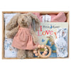 ROOM TO BLOOM Bluebirds Baby Gift Hamper set in a wooden box featuring a Peter Rabbit book, a pink knitted blanket, a wooden bead teether, a swaddle, headband and plush rabbit.