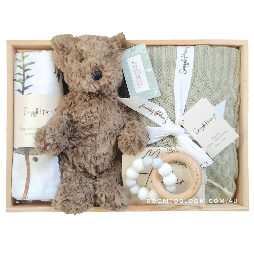 ROOM TO BLOOM Brave Baby Gift Hamper set with teddy bear, blanket, and teething ring in a wooden box.