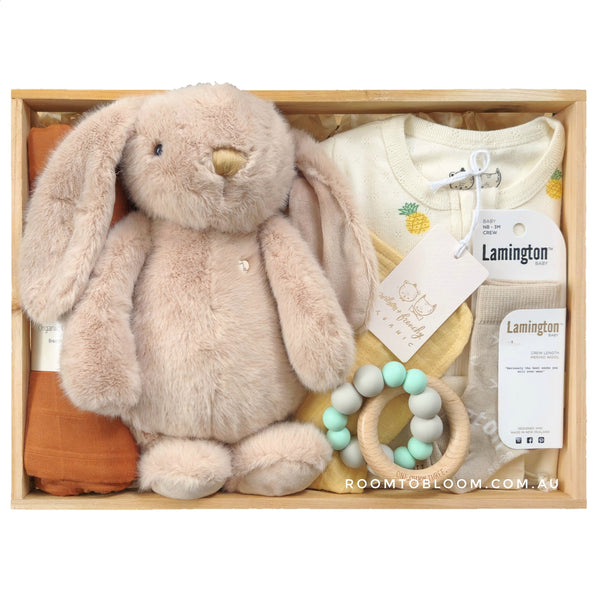 ROOM TO BLOOM Brown Sugar Baby Gift Hamper set with plush bunny, teether, clothing and more in a wooden box.