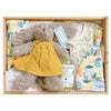 ROOM TO BLOOM Clementine Baby Gift Hamper set with bunny, clothing, and other products in a wooden box.