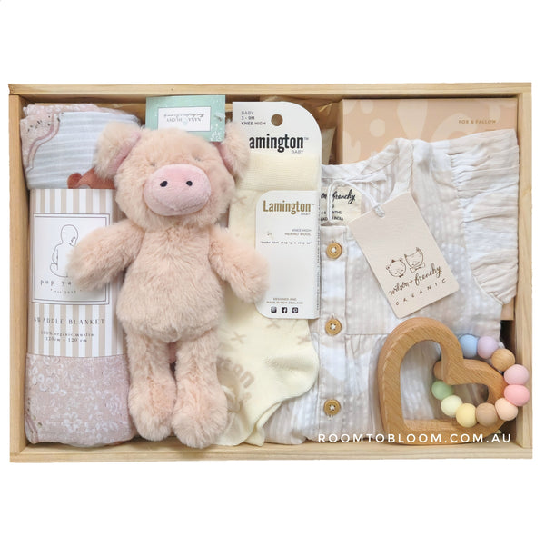 LAMINGTON Daisy Baby Gift Hamper set with plush toy, baby dress, and teething ring and more in a wooden box.