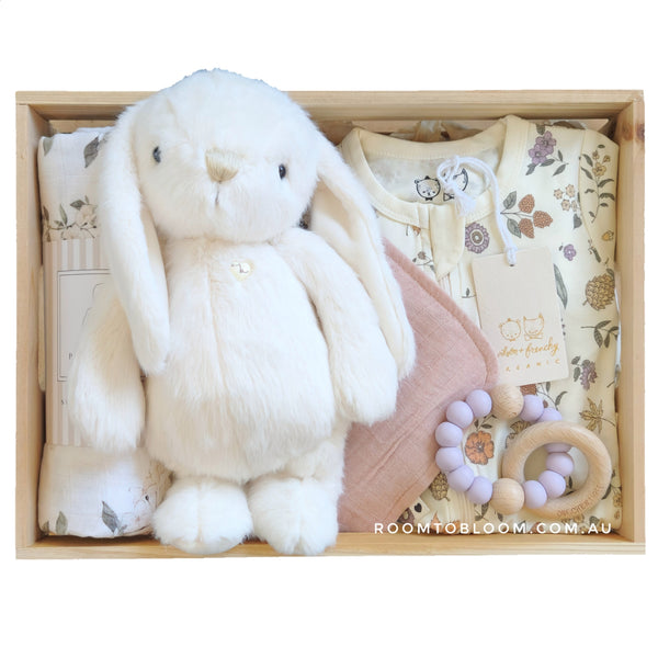 ROOM TO BLOOM Dreaming of You Baby Gift Hamper set with plush bunny, clothing, and more in a wooden box.