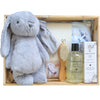 ROOM TO BLOOM Fly High Baby Gift Hamper set with plush toy, bath products, and a brush in a wooden box.