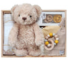 ROOM TO BLOOM Forever Friends Baby Gift Hamper set with teddy bear, pacifiers, and more in a wooden box.