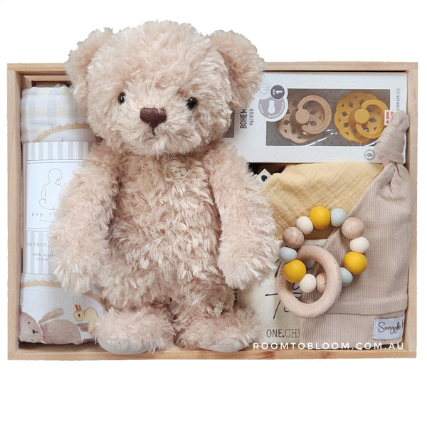 ROOM TO BLOOM Forever Friends Baby Gift Hamper set with teddy bear, pacifiers, and more in a wooden box.
