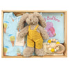 ROOM TO BLOOM Fun Days Baby Gift Hamper set with a bunny in yellow overalls, baby onesie, and book and teether in a wooden box.