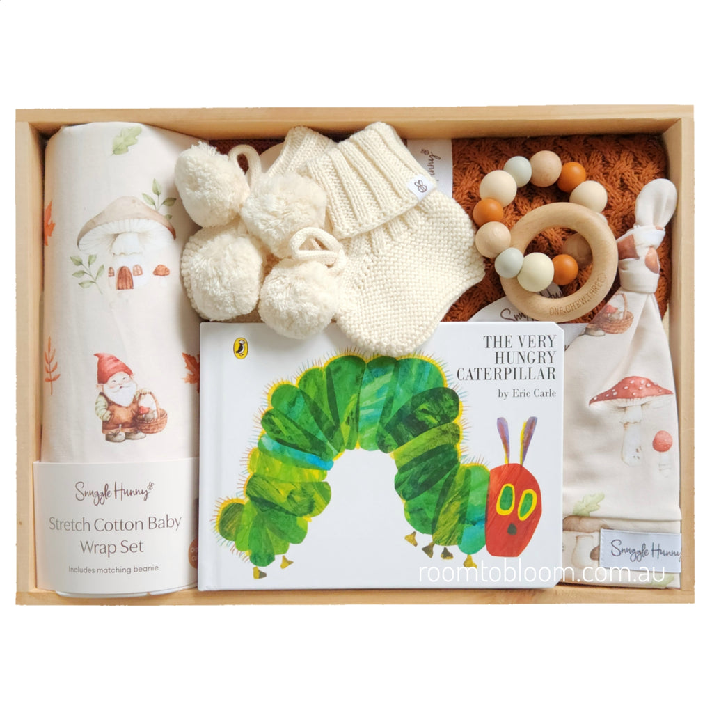ROOM TO BLOOM Gnome Sweet Gnome Baby Gift Hamper set with items including a book, wrap, and rattle in a wooden box.