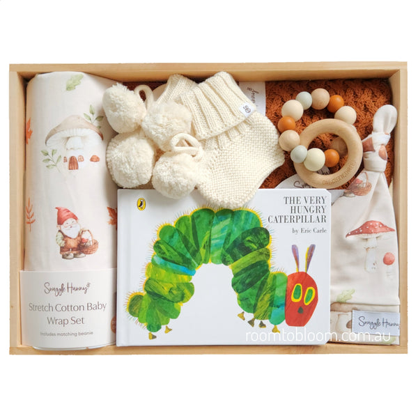 ROOM TO BLOOM Gnome Sweet Gnome Baby Gift Hamper set with items including a book, wrap, and rattle in a wooden box.