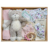 ROOM TO BLOOM Gracie Baby Gift Hamper set arranged in a wooden tray, featuring a plush kitten, folded pink swaddle, floral baby romper and headband, pink mittnes and a wooden bead teether.