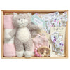 ROOM TO BLOOM Gracie Baby Gift Hamper set arranged in a wooden tray, featuring a plush kitten, folded pink swaddle, floral baby romper and headband, pink mittnes and a wooden bead teether.