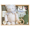 ROOM TO BLOOM Jungle Friends Baby Gift Hamper set with teddy bear, teething ring, and organic cotton items in a box.