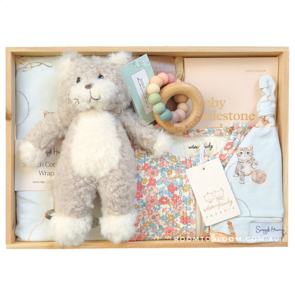 ROOM TO BLOOM Kitty Kat Baby Gift Hamper set with plush kitten, teething ring, and other items in a wooden box.