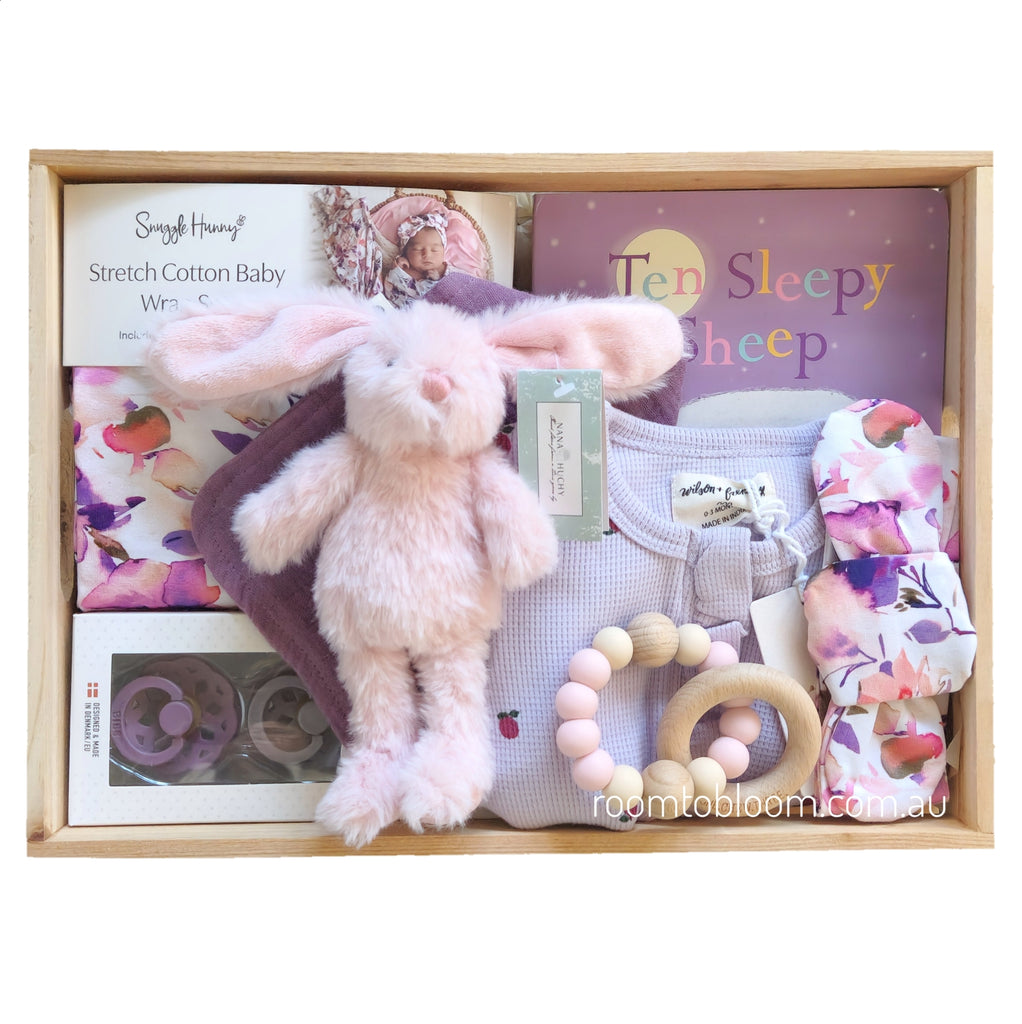ROOM TO BLOOM Lilac Love Baby Gift Hamper set with plush toy, baby clothes, rattle and more in a wooden box.