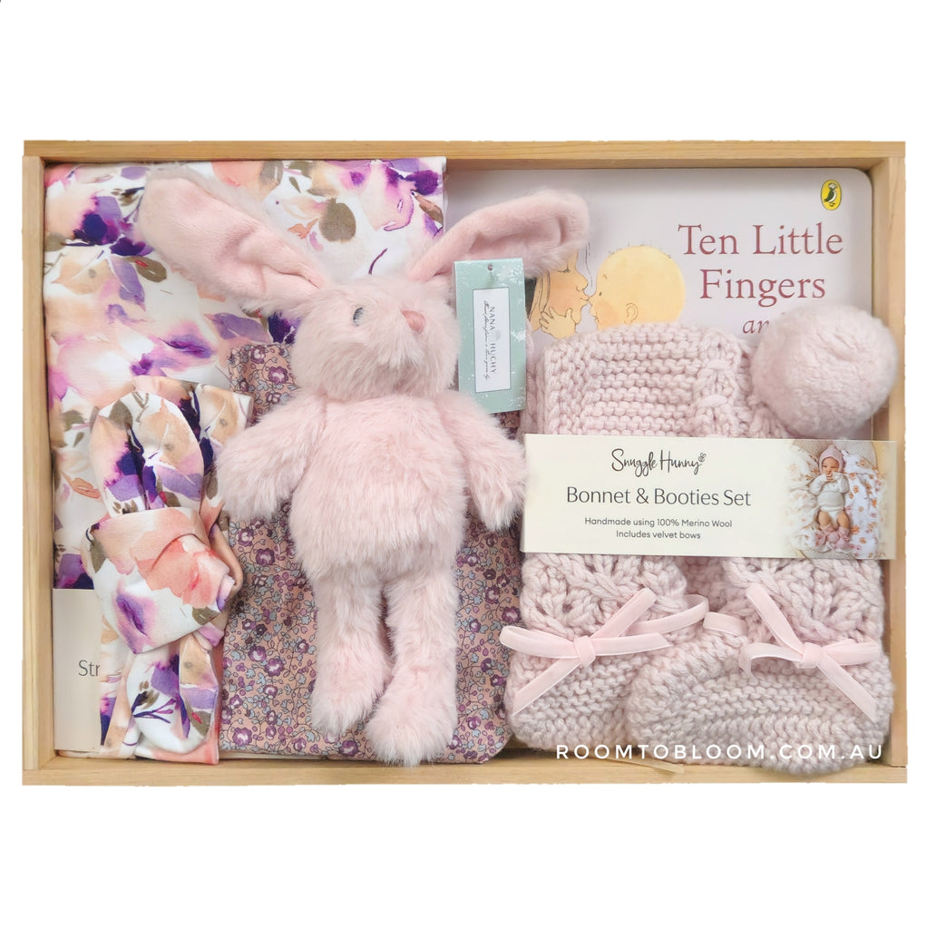 ROOM TO BLOOM Lisianthus Baby Gift Hamper gift set with plush bunny, blanket, and booties in a wooden box.
