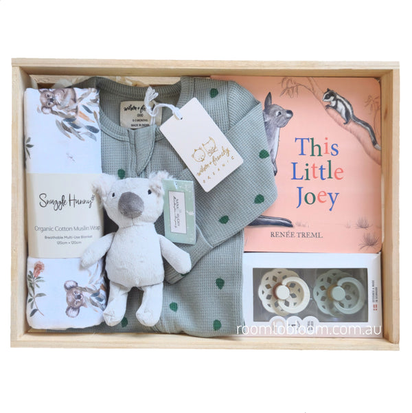 ROOM TO BLOOM Little Aussie Baby Gift Hamper set with clothing, toy, book, pacifiers and more in a wooden box.