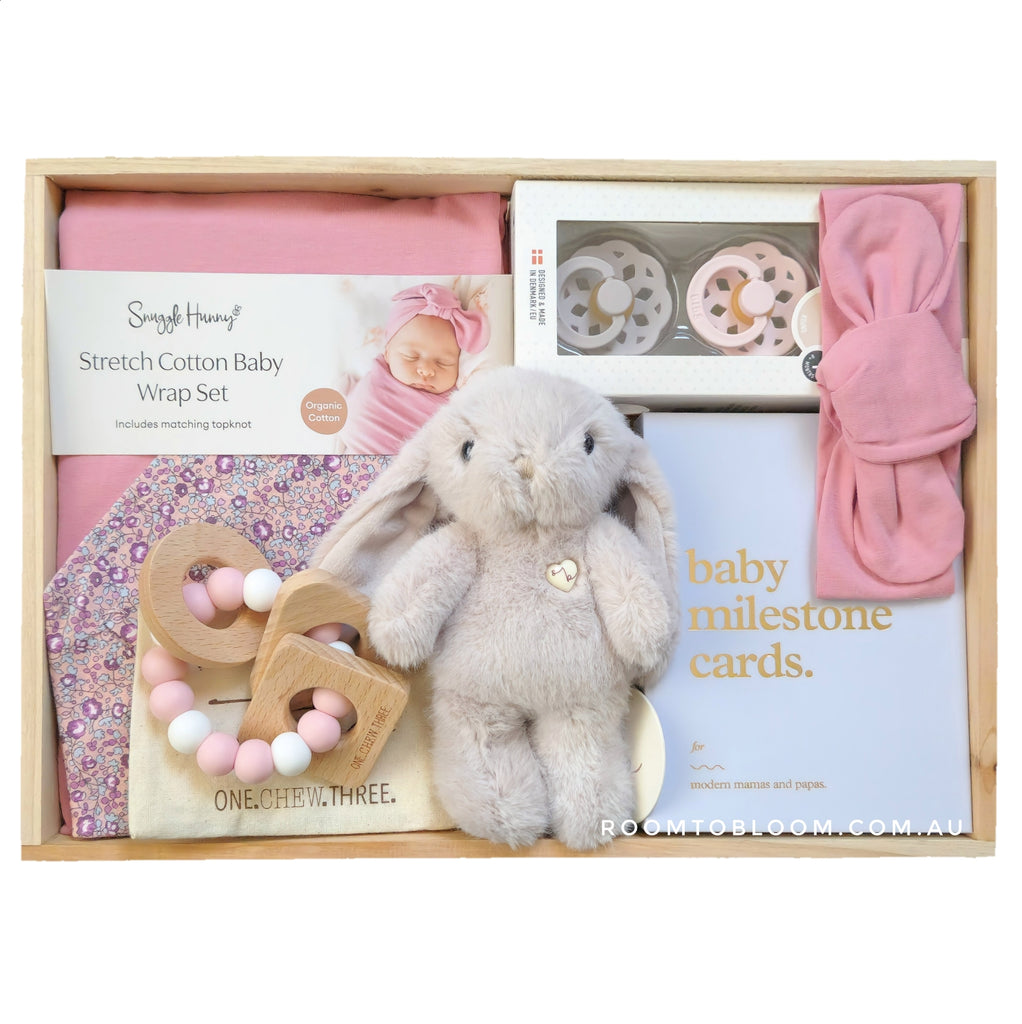 ROOM TO BLOOM Little Flower Baby Gift Hamper set with plush toy, milestone cards, and other items in a wooden box.