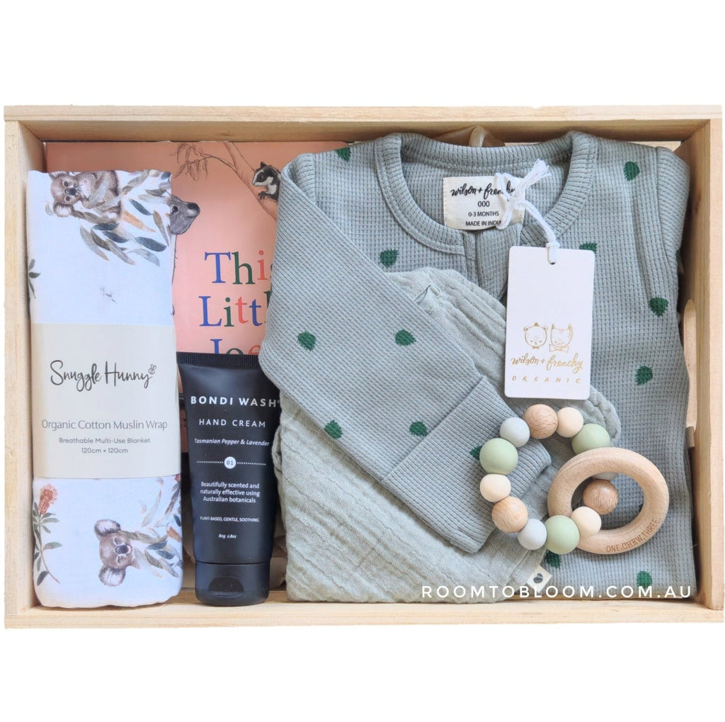ROOM TO BLOOM Little Joey Baby Gift Hamper set with clothiing, a swaddle, a book and more in a wooden box.
