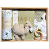ROOM TO BLOOM Lush Baby Gift Hamper set with plush toy, book record book, and other gender-neutral items in a wooden box.
