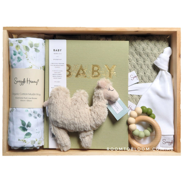 ROOM TO BLOOM Lush Baby Gift Hamper set with plush toy, book record book, and other gender-neutral items in a wooden box.