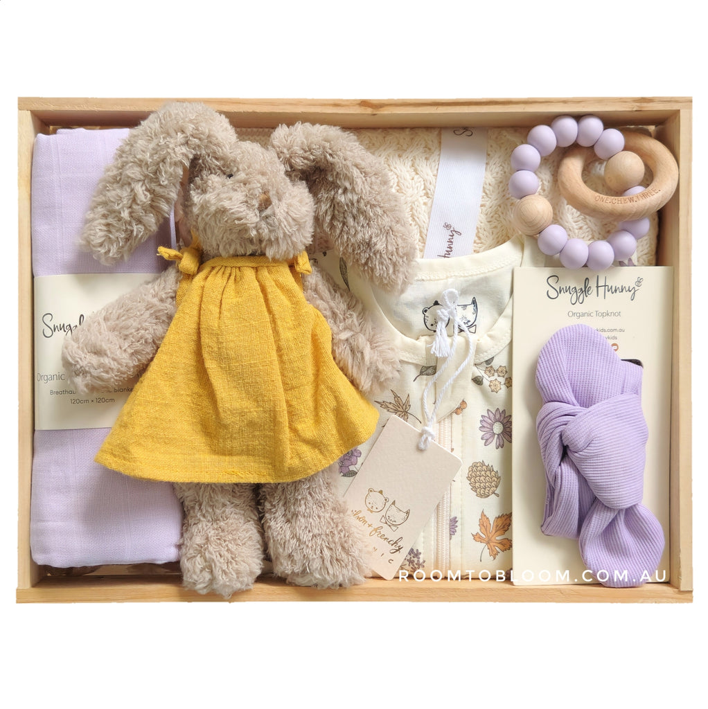 ROOM TO BLOOM Maple Baby Gift Hamper set with plush bunny, zipsuit, teething ring, and more in a wooden box.