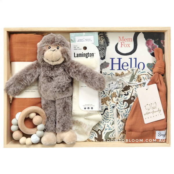 ROOM TO BLOOM Monkey Around Baby Gift Hamper set with plush toy, baby clothes, toys and more in a wooden box.