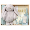 ROOM TO BLOOM Monster Mash Baby Gift Hamper set with plush bunny, baby clothes, and other items in a wooden box.