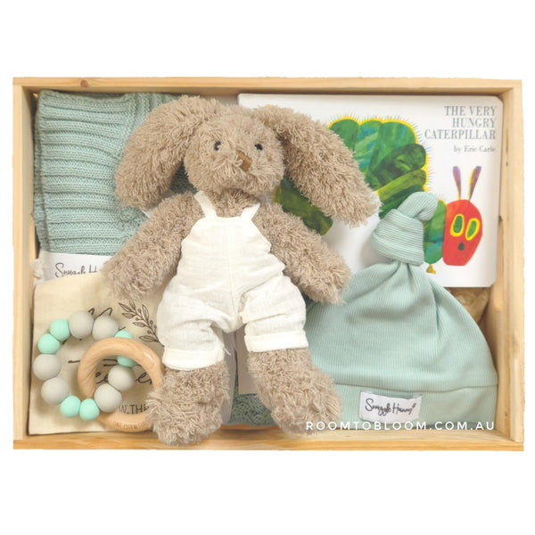 ROOM TO BLOOM Nature Trail Baby Gift Hamper set with blanket, plush toy, teether, and more in a wooden box.