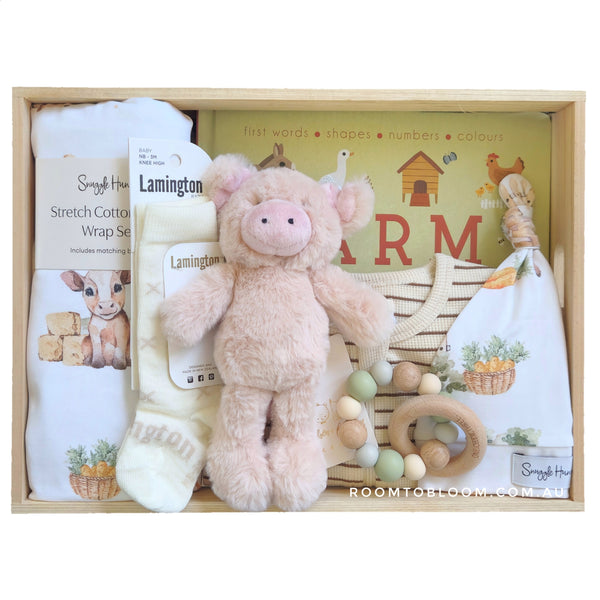 ROOM TO BLOOM On the Farm Baby Gift Hamper set with plush toy, baby swaddle, a book and more in a wood box.