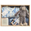 ROOM TO BLOOM Party Animals Baby Gift Hamper set with baby clothes, plush toy, rattle and more in a wooden box.