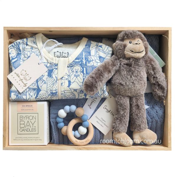 ROOM TO BLOOM Party Animals Baby Gift Hamper set with baby clothes, plush toy, rattle and more in a wooden box.