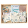 ROOM TO BLOOM Peek-a-Boo Baby Gift Hamper set in a light wood box featuring a cream zip-up baby romper, a wooden beaded teether, a book and blanket.