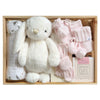 ROOM TO BLOOM Powder Pink Baby Gift Hamper set with plush bunny, swaddle, a candle and more in a wooden box.