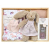 ROOM TO BLOOM Prancer Baby Gift Hamper set in a wooden box featuring a plush bunny in a pale lilac dress, pink mittens, a floral baby swaddle and headband, a pink bib, and pacifiers.