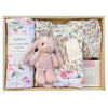 ROOM TO BLOOM Pretty Petal Baby Gift Hamper set in a light wood box featuring a pink plush bunny, a floral baby wrap set, a floral baby dress, and a Byron Bay candle.