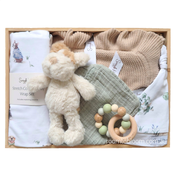 ROOM TO BLOOM Puppy Play Baby Gift Hamper set with plush toy, knitted blanket, rattle and more in a wooden box.