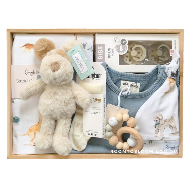 ROOM TO BLOOM Puppy Playground Baby Gift Hamper set with plush toy, clothing, toy and more in a wooden box.