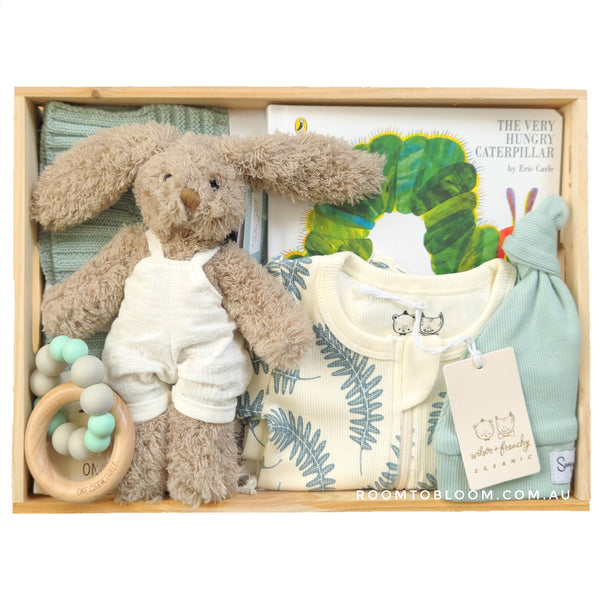 ROOM TO BLOOM  Pure Love Baby Gift Hamper set with plush toy, clothing, a book and more in a wooden box.