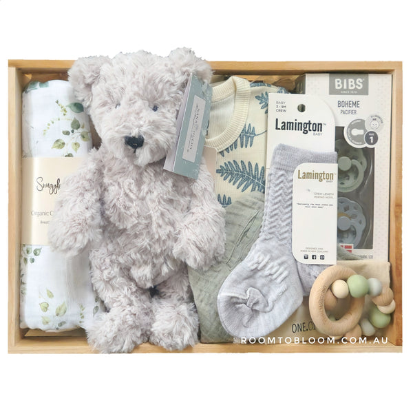 ROOM TO BLOOM Rainforest Baby Gift Hamper set with plush teddy bear, baby romper, an teddy and more in a wooden box.