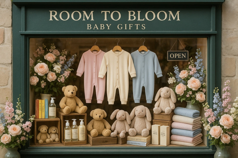 Display of baby gifts with 'Room to Bloom' sign