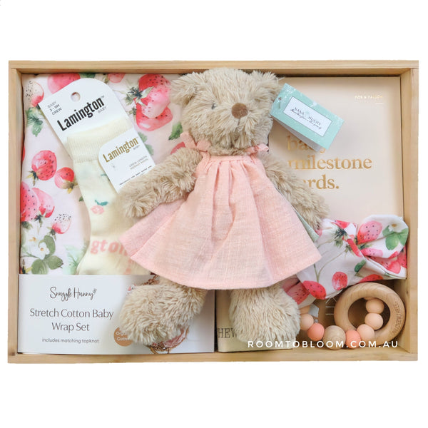 ROOM TO BLOOM Strawberry Kisses Baby Gift Hamper set with teddy bear, wrap, and toy and more in a wooden box.