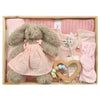 ROOM TO BLOOM Strawberry Lemonade Baby Gift Hamper set with plush bunny in dress, wooden heart teether, and other pink items in a box.
