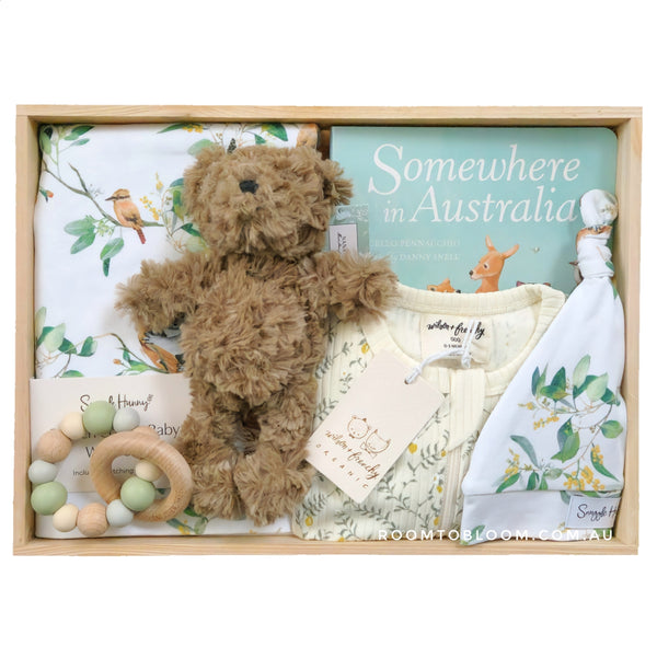 ROOM TO BLOOM Trees of Green Baby Gift Hamper set with teddy bear, clothing, and more in a wooden box.